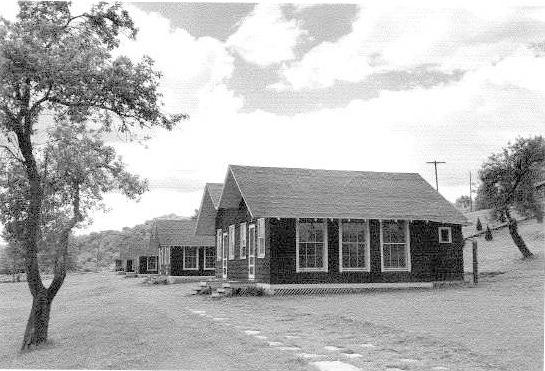Higgs 9b.jpg - Looks like Cliffside cabins 7-8 with 1-6 in the background. Later, the flagstone walkway was raised, and the area between stones was cemented. There was a rudimentary water fountain about here (bad iron-water taste!), later replaced by a 4-poster shelter and a refrigerated water fountain. Still tasted terrible!